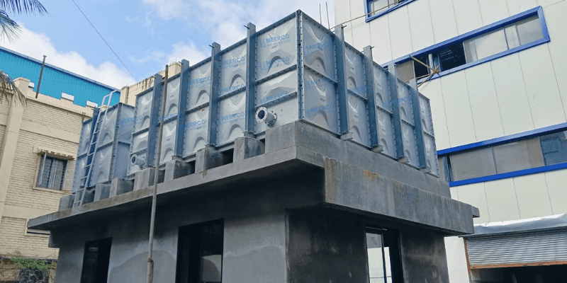 Terrace-Level Installation — Compact rooftop tank between blocks