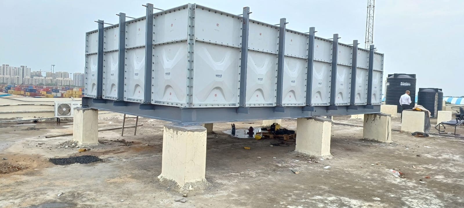 Terrace-Level GRP Tank — Column-supported rooftop platform